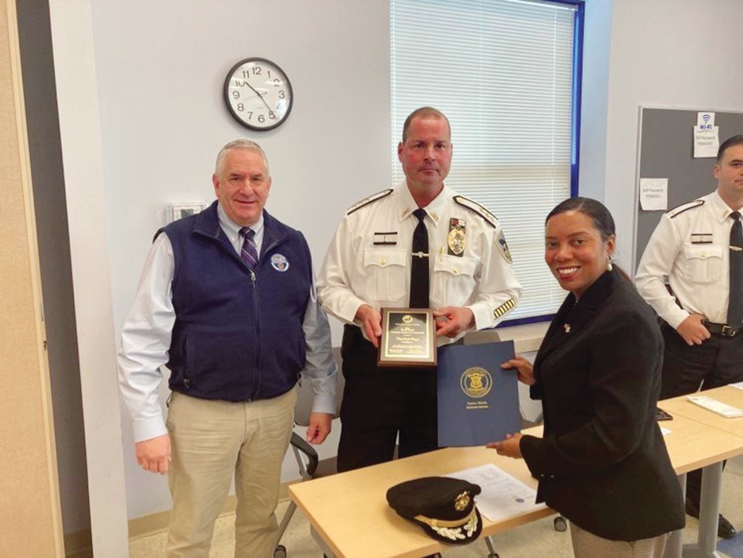 EMERGENCY MANAGER OF THE YEAR: Johnston Police Chief Joseph Razza is presented with the Emergency Manager of the Year Award by Rhode Island Emergency Management Agency Director Marc Pappas and Lieutenant Governor Sabina Matos for excellence, dedication and accomplishment in emergency management.